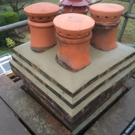 Rebuilt chimney with new flaunching and pots, a typical Tresan roof repair in Surrey