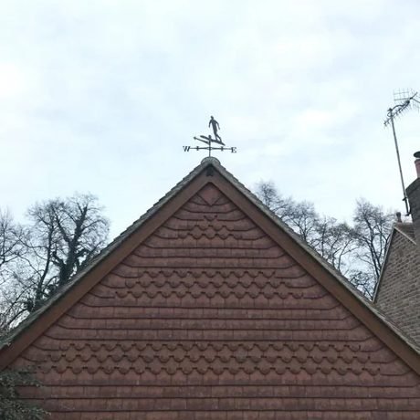 Vertical clay tile hanging on a gable end, fitted by Tresan Roofing in Surrey